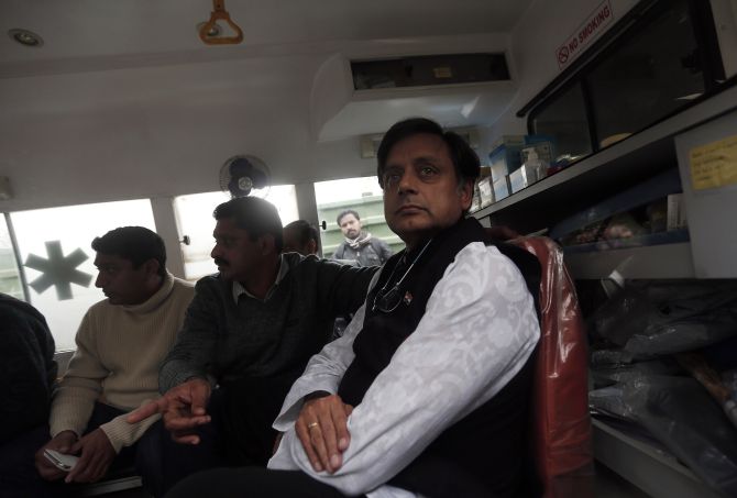 Tharoor sits in an ambulance as he waits outside a mortuary to receive his wife Sunanda Puskhar Tharoor's body at a hospital in New Delhi on Saturday