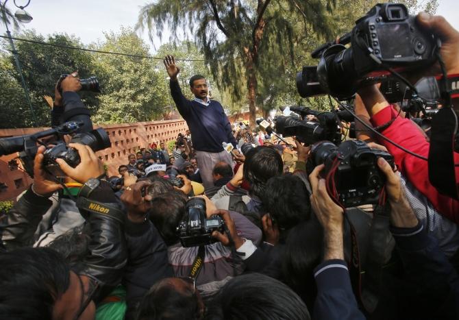 Delhi Chief Minister Arvind Kejriwal greets supporters during a protest in New Delhi.