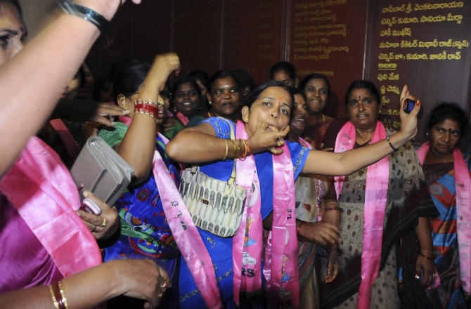 Telangana supporters cheer as they celebrate after the announcement of the separate state of Telangana at their party headquarters in Hyderabad in this photograph taken on July 30, 2013.