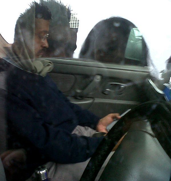 Kejriwal on the phone in his now-famous Maruti Suzuki Wagon R