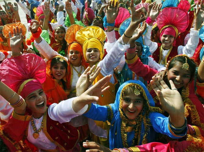 Students cheer after performing a cultural programme during the Republic Day celebration in Chandigarh.