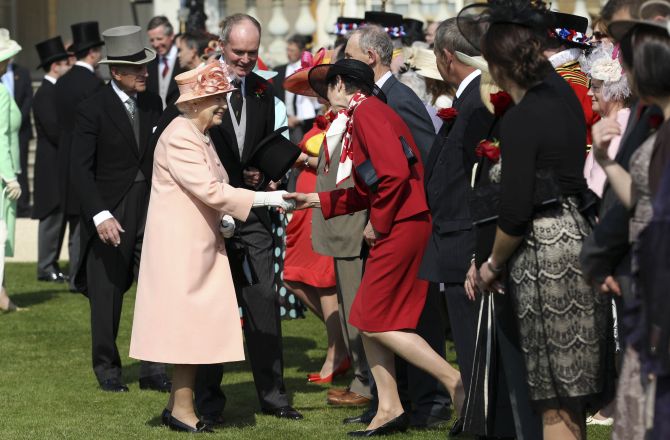 Queen Elizabeth receiving guests at the Buckingham Palace lawns