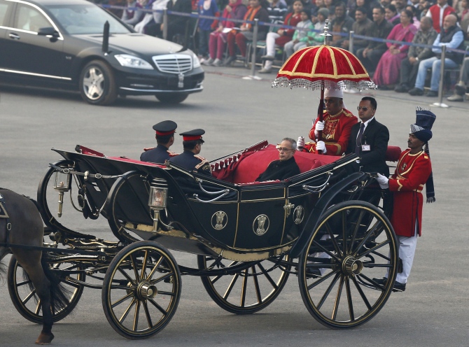 President Pranab Mukherjee arrives in a ceremonial buggy for the Beating the Retreat ceremony in New Delhi
