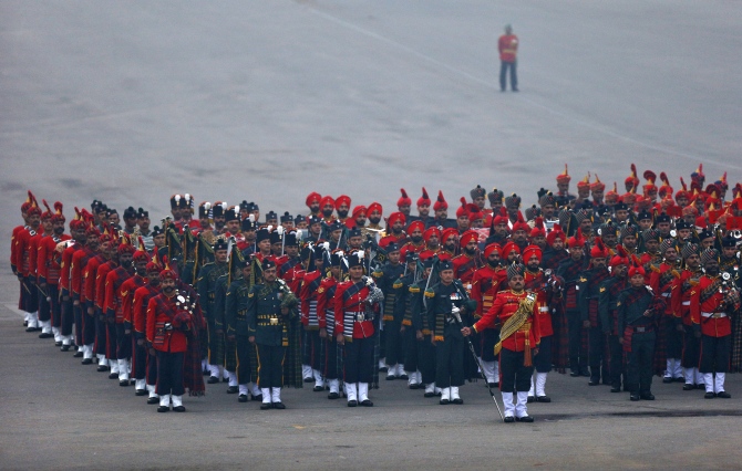 Bands of the Indian military stand to attention during the 'Beating the Retreat' ceremony in New Delhi.