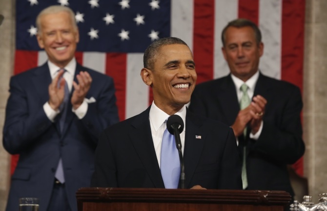 Vice President Joe Biden and Speaker of the House John Boehner applaud as Obama finishes his State of the Union speech on Capitol Hill