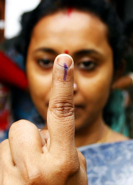 A voter shows the indelible ink mark on her finger after casting her ballot at a polling booth in Siliguri during the 2009 Lok Sabha elections.