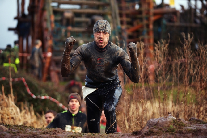A competitor poses for a photo during the Tough Guy Challenge in Telford, England.