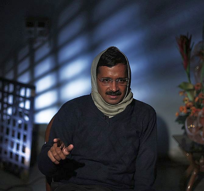 Delhi's Chief Minister Arvind Kejriwal speaks during an interview with Reuters at his residence
