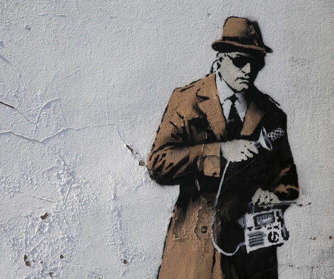 A detail from graffiti art is seen on a wall near the headquarters of Britain's eavesdropping agency, Government Communications Headquarters, known as GCHQ, in Cheltenham, western England