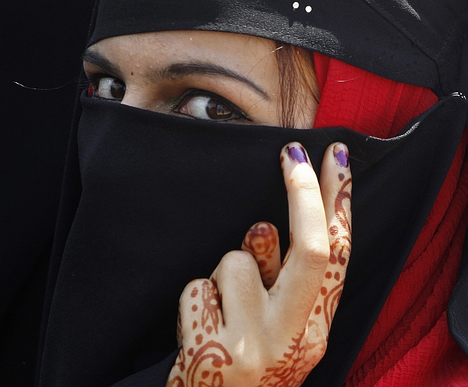 A member a Kashmiri women's separatist group attends a protest in Srinagar