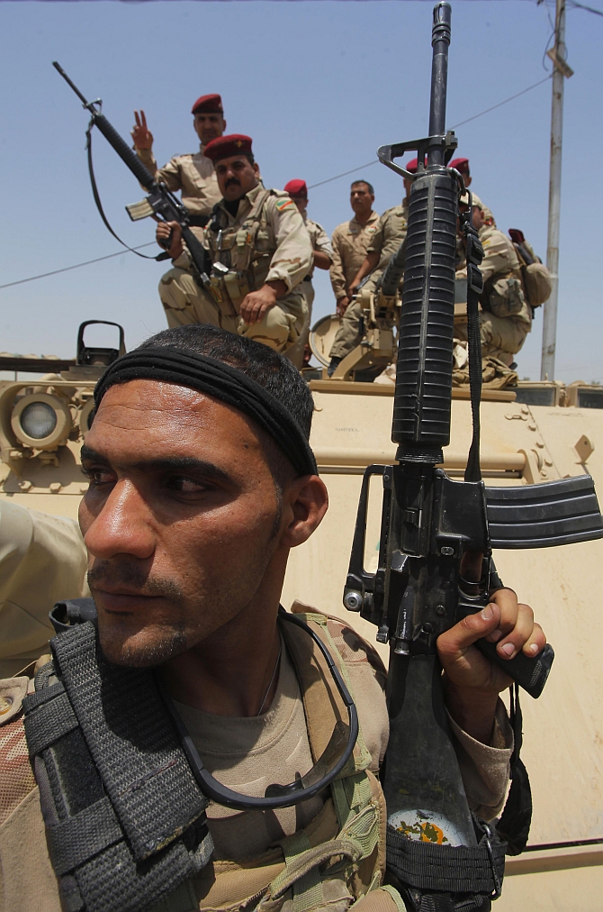 An Iraqi Soldier prepares during an intensive security deployment in Iraq