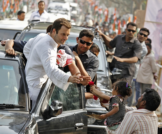 Congress Vice President Rahul Gandhi during a road show in Assam's Samuguri village