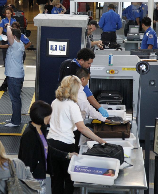 Travellers go through a TSA security checkpoint at LAX airport in Los Angeles