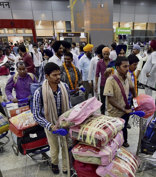 Indian workers rescued from Iraq arrive at the Delhi airport