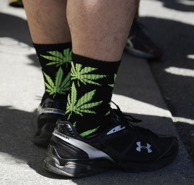 Spirits high as legal marijuana goes on sale in Washington