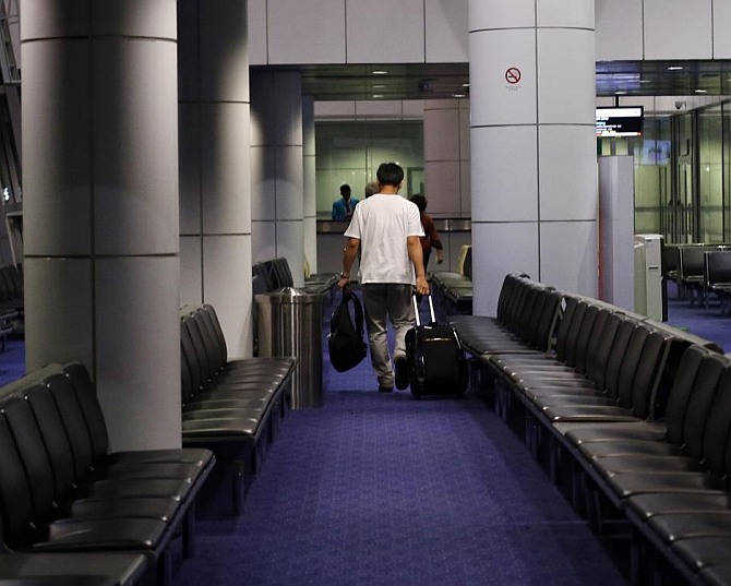 A passenger prepares to board a flight at Singapore airport. Photograph used only for representational purposes.