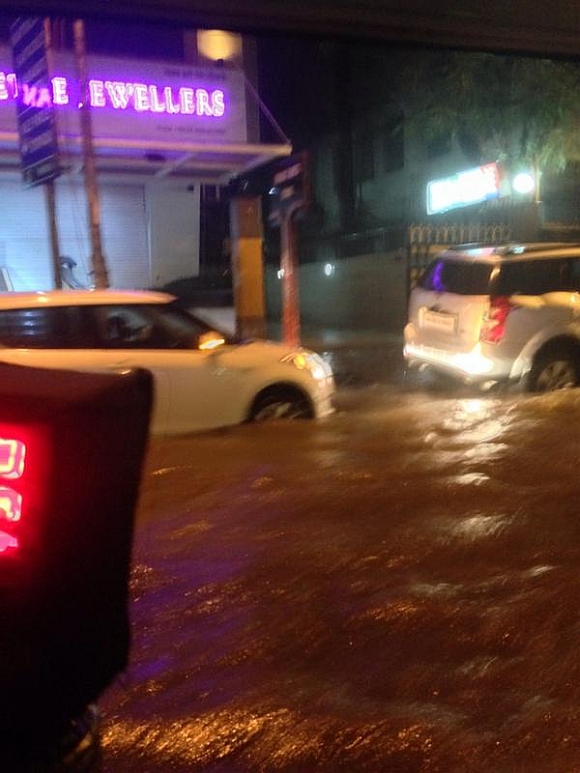 Knee-deep water slowed traffic outside Vile Parle station