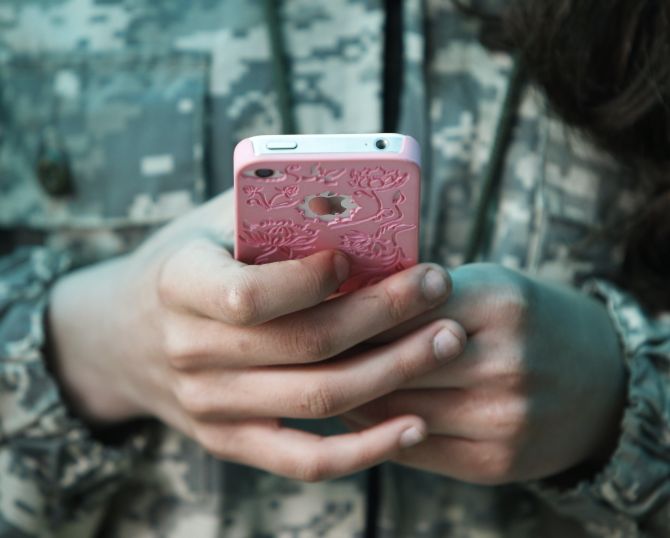 A girl holds a phone in her hand. The image is used for representational purposes only.