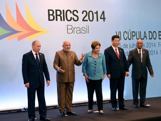 The five leaders smile as they pose for photographs during the summit