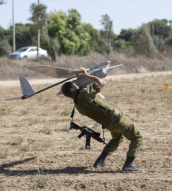 An Israeli soldier launches a Skylark unmanned aerial vehicle near the Israeli-Gaza Border 