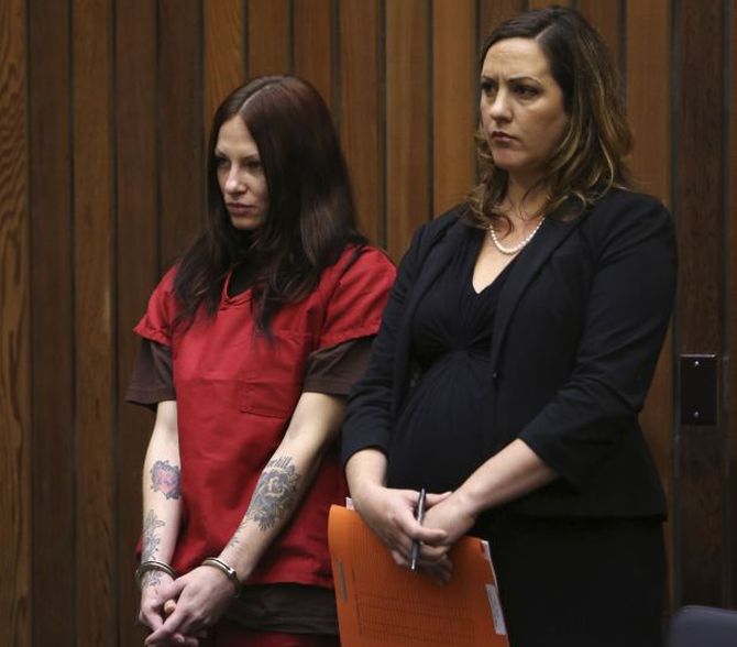Alix Tichelman stands in the courtroom with one of her attorneys, Athena Reis, during her arraignment in Santa Cruz on July 16.