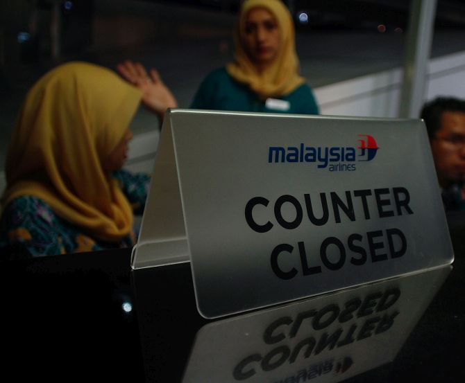 Counters of Malaysia Airlines remain shut after flight MH17 was shot down