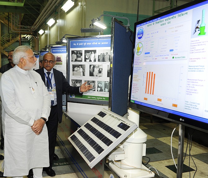 Prime Minister Modi being briefed about BARC exhibition