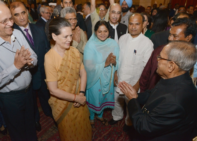President Pranab Mukherjee greets Congress president Sonia Gandhi