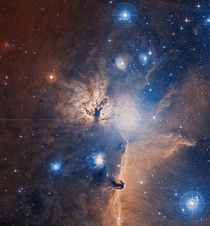 An optical image, from the Digitized Sky Survey, of a large field centered on the Flame Nebula. A comparison with the composite image from Chandra and Spitzer - shown as an overlay - demonstrates how powerful X-ray and infrared images are for studying star forming regions. The central cluster of stars, NGC 2024, is clearly observed in the X-ray and optical images but is not visible in the optical image.