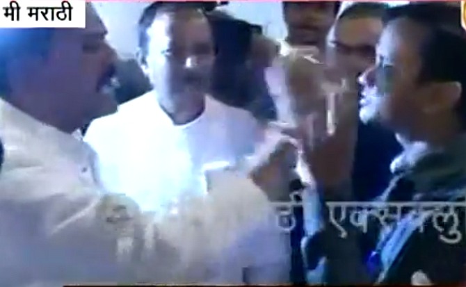 Video grab showing Shiv Sena's Thane MP Rajan Vichare force-feeding Arshad