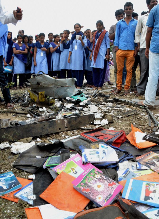 Books and other belongings of the school kids aboard the bus strewn on the ground