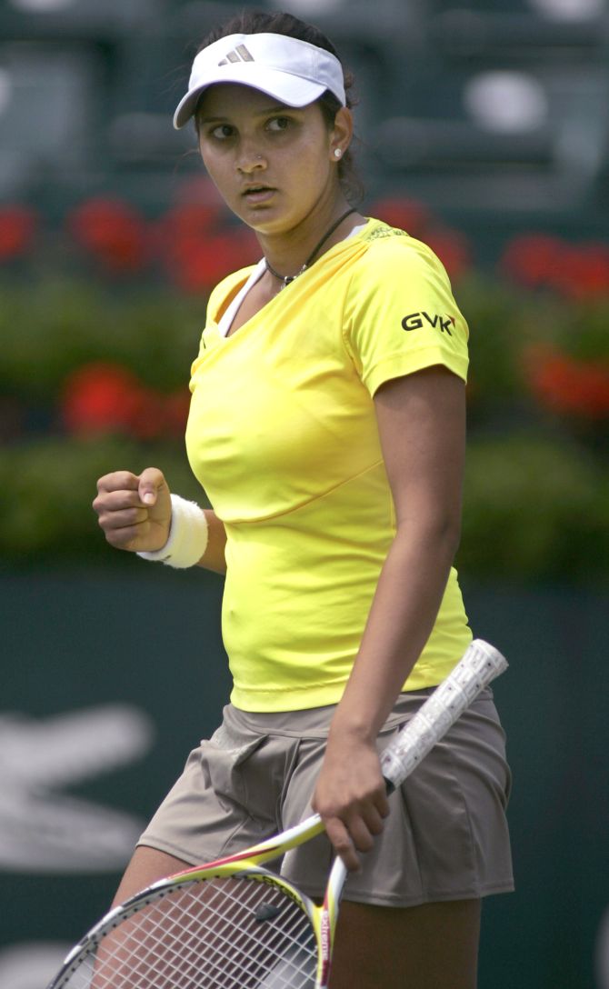 Sania Mirza of India reacts after winning a tennis match