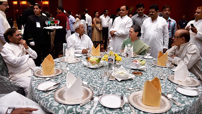 Congress President Sonia Gandhi with RJD chief Lalu Yadav, JD(U) chief Sharad Yadav and NCP leader Tariq Anwar (R) during her Iftar party