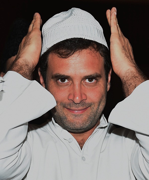 Congress Party Vice president Rahul Gandhi adjusts his cap during the Iftar