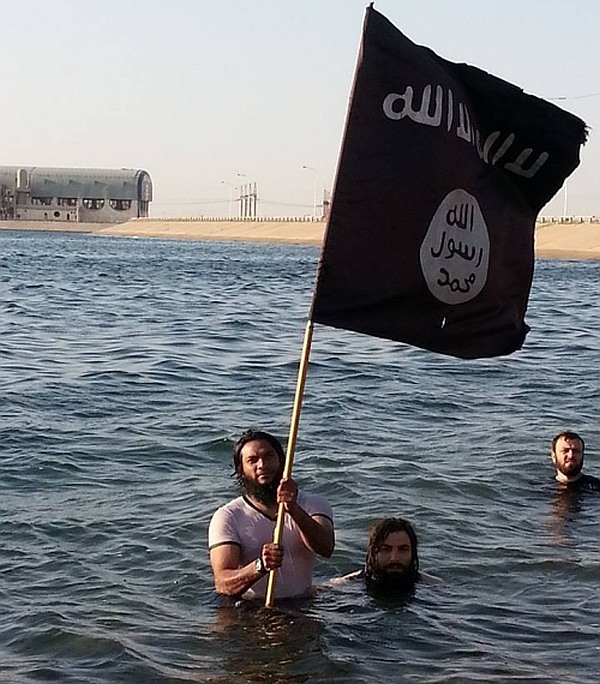 Haja Fakruddin waves the ISIS flag.