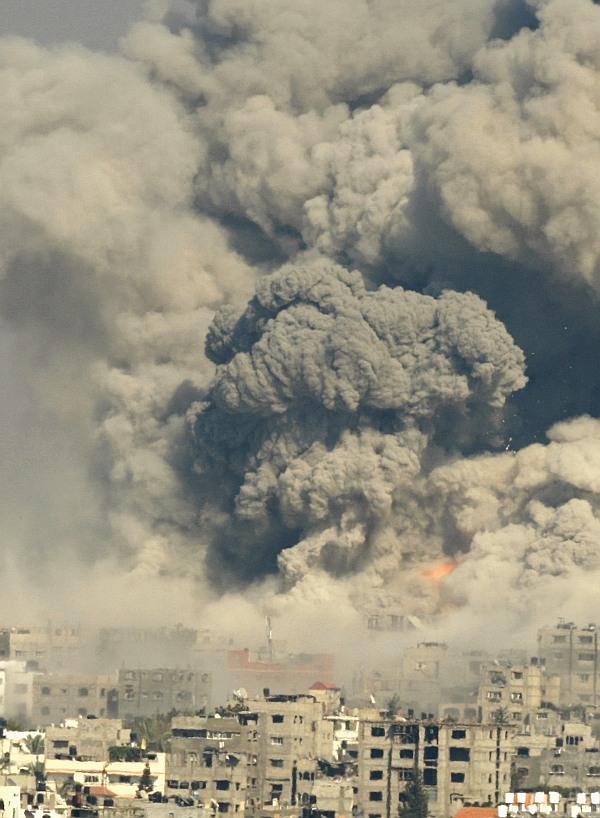 Smoke rises following what witnesses said were Israeli air strikes in the east of Gaza City