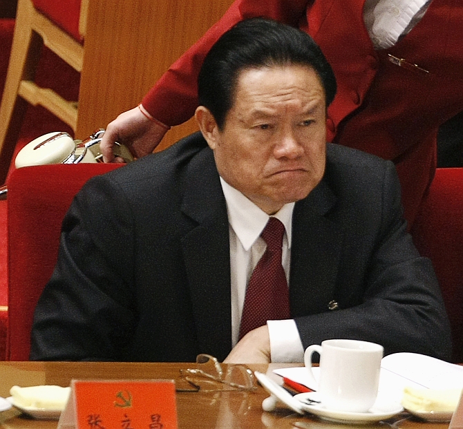China's then public security minister Zhou Yongkang attends the opening ceremony of the 17th National Congress of the Communist Party of China at the Great Hall of the People, in Beijing in this October 15, 2007