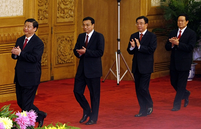 Chinse President Xi Jinping, Premier Li Keqiang, retired high-ranking official in the Communist Party of China He Guoqiang and Zhou Yongkang meet with the media at the Great Hall of the People in Beijing in October 22, 2007