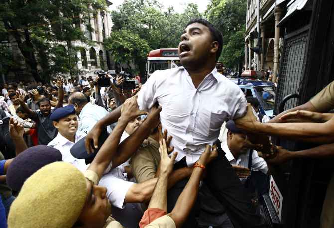 Activists of Socialist Unity Centre of India in Kolkata being detained by police during a protest against the recent rail fare hike