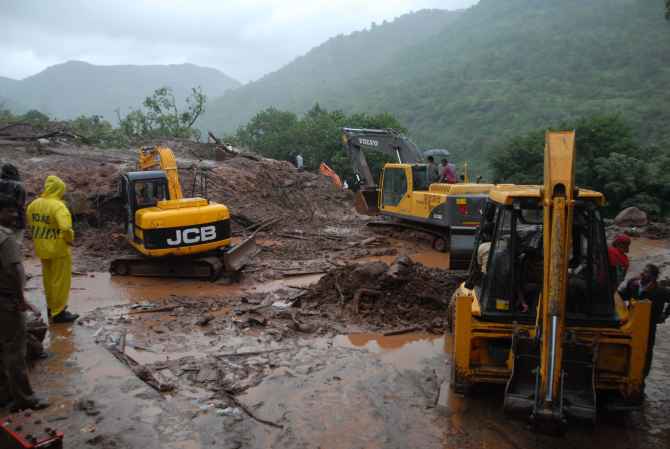 JCB machines engaged in rescue and relief work at the site of the landslide near Pune