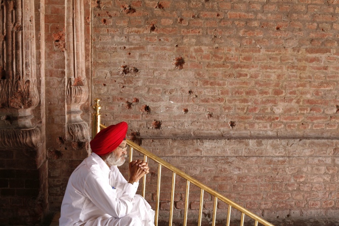 A Sikh devotee prays inside the Golden Temple complex.