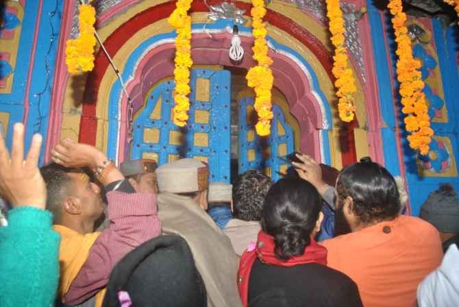 Devotees at the temple's entrance at the reopening.