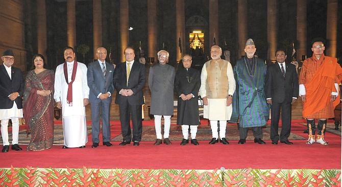 Then Nepal prime minister Sushil Koirala, Bangladesh Speaker Shirin Sharmin Chaudhury, then Sri Lanka president Mahinda Rajapaksa, then Mauritius president Navin Ramgoolam, then Pakistan prime minister Nawaz Sharif, then vice-president Hamid Ansari, then President Pranab Mukherjee, Prime Minister Narendra D Modi, then Afghanistan president Hamid Karzai, Maldives President Yameen Abdul Gayoom and Bhutan Prime Minister Tshering Tobgay soon after the Modi government was sworn in, May 26, 2014. Photograph: Press Information Bureau