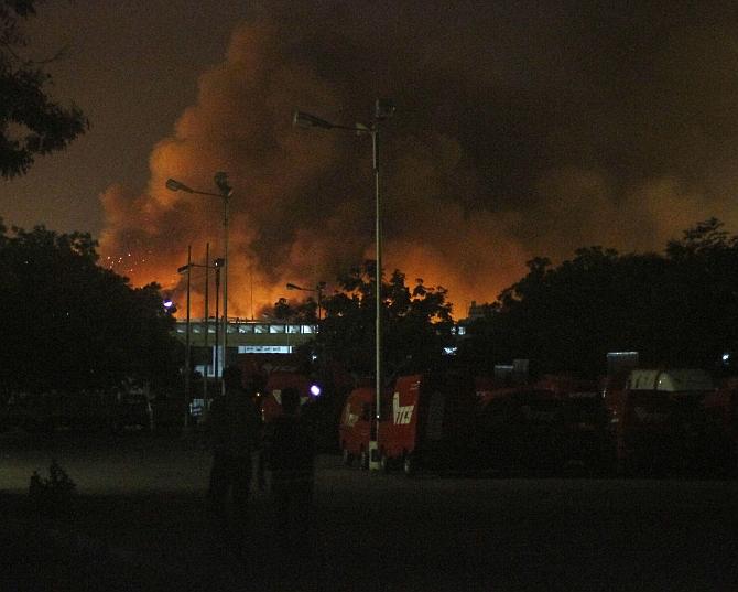 Smoke billows from Jinnah International Airport in Karachi