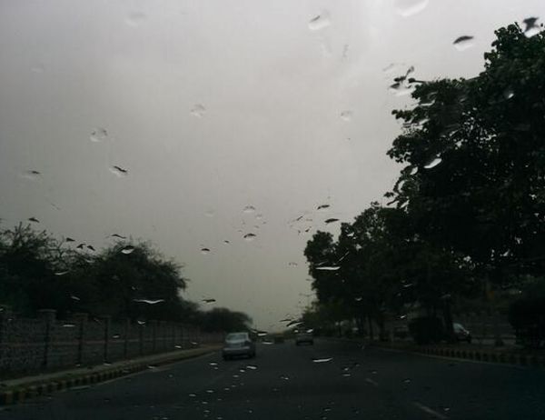 PHOTOS: After sweating it out, Delhi chills with rains