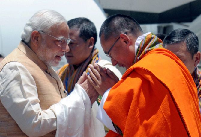 Modi is welcomed by Bhutan PM Tshering Tobgay.