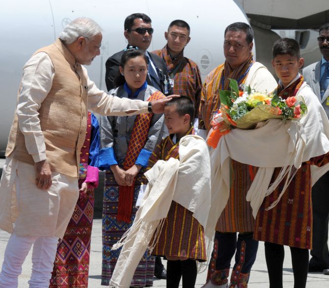 A little boy welcomes PM Modi at Paro airport in Bhutan.