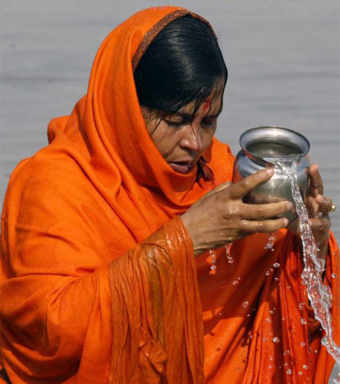 Minister for Water Resources, River Development and Ganga Rejuvenation Uma Bharti performs prayers at the Ganga