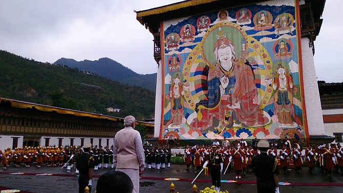 Modi inspects the guard of honour in Thimpu on Sunday