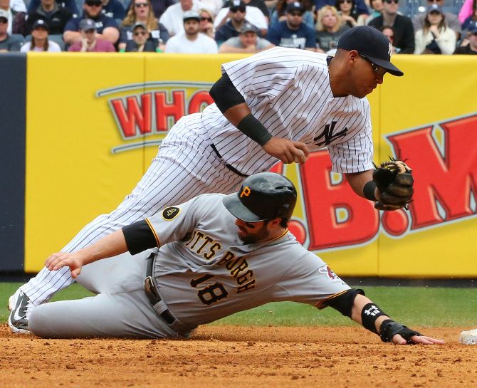 Pittsburgh Pirates second baseman Neil Walker slides into second base during a match with the New York Yankees at the Yankees Stadium.